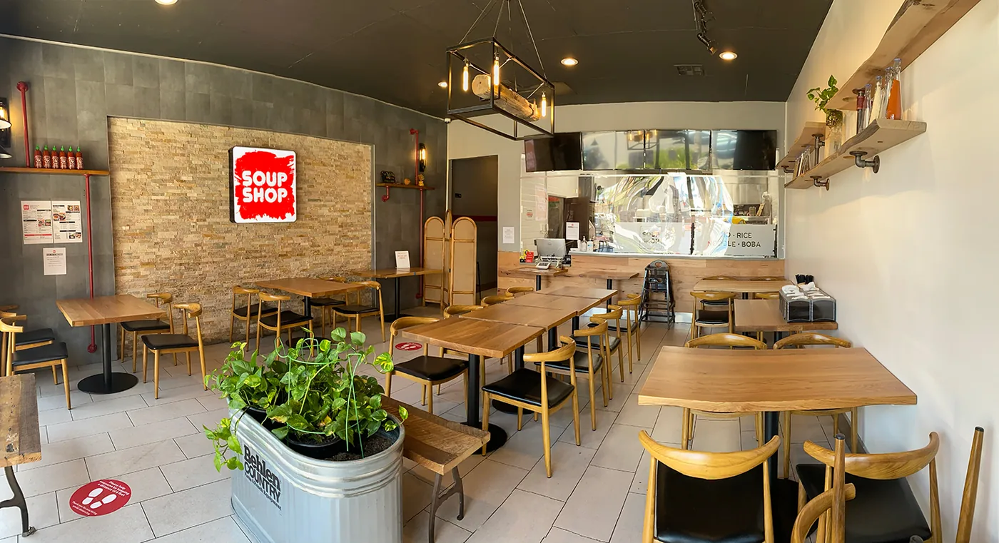 Soup Shop dining room with wood tables and an open counter